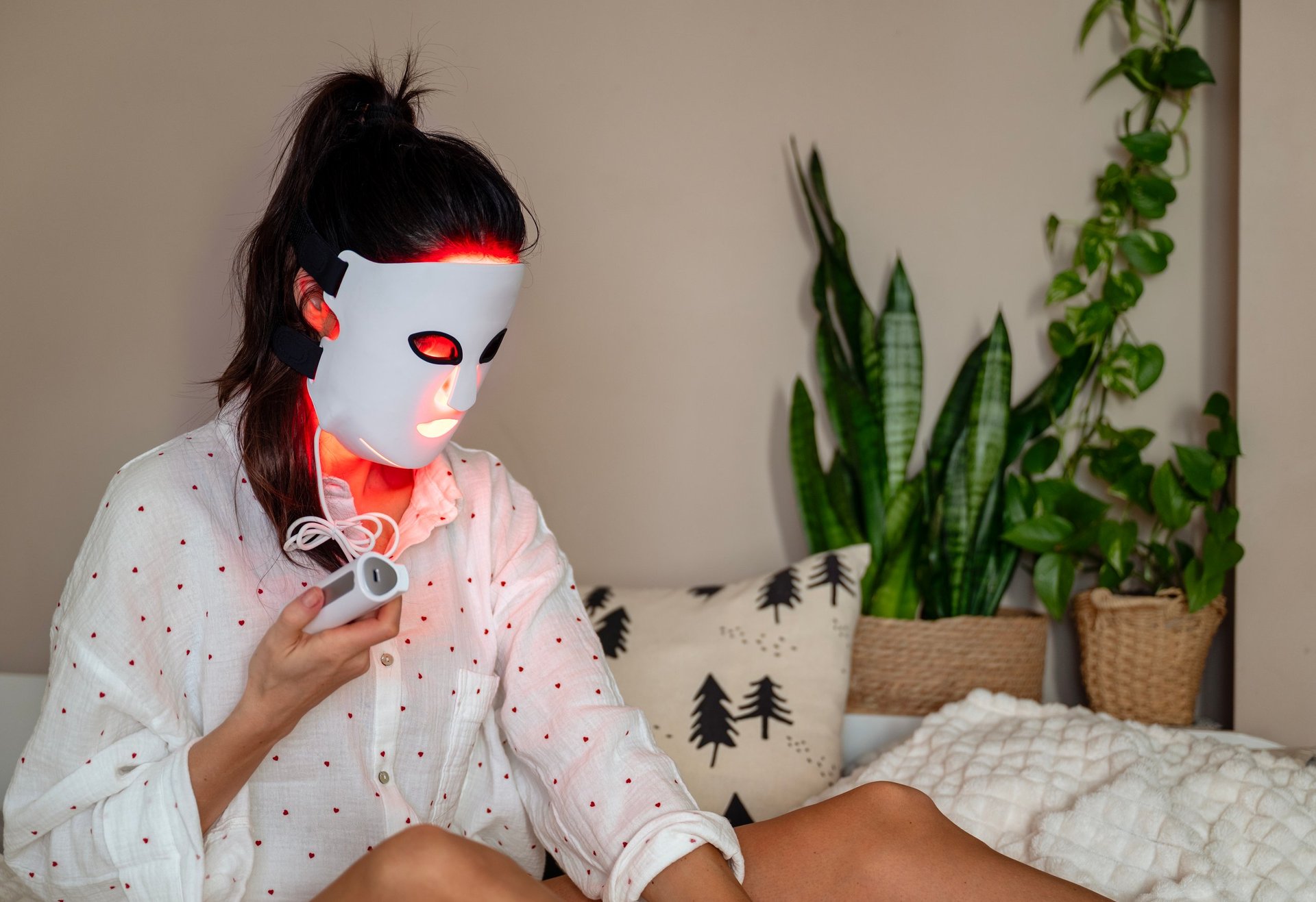 Woman getting LED light facial treatment